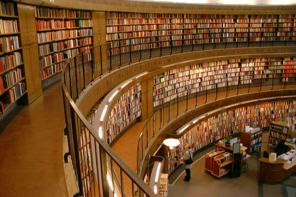 Books on a curving library wall
